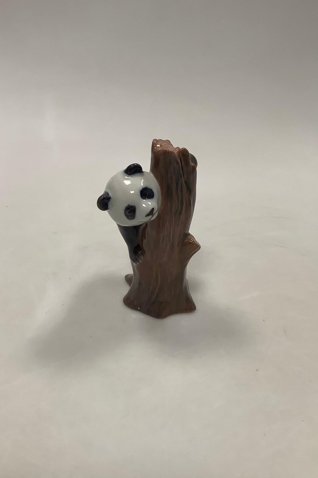 Royal Copenhagen Figure Panda on tree stump No 664