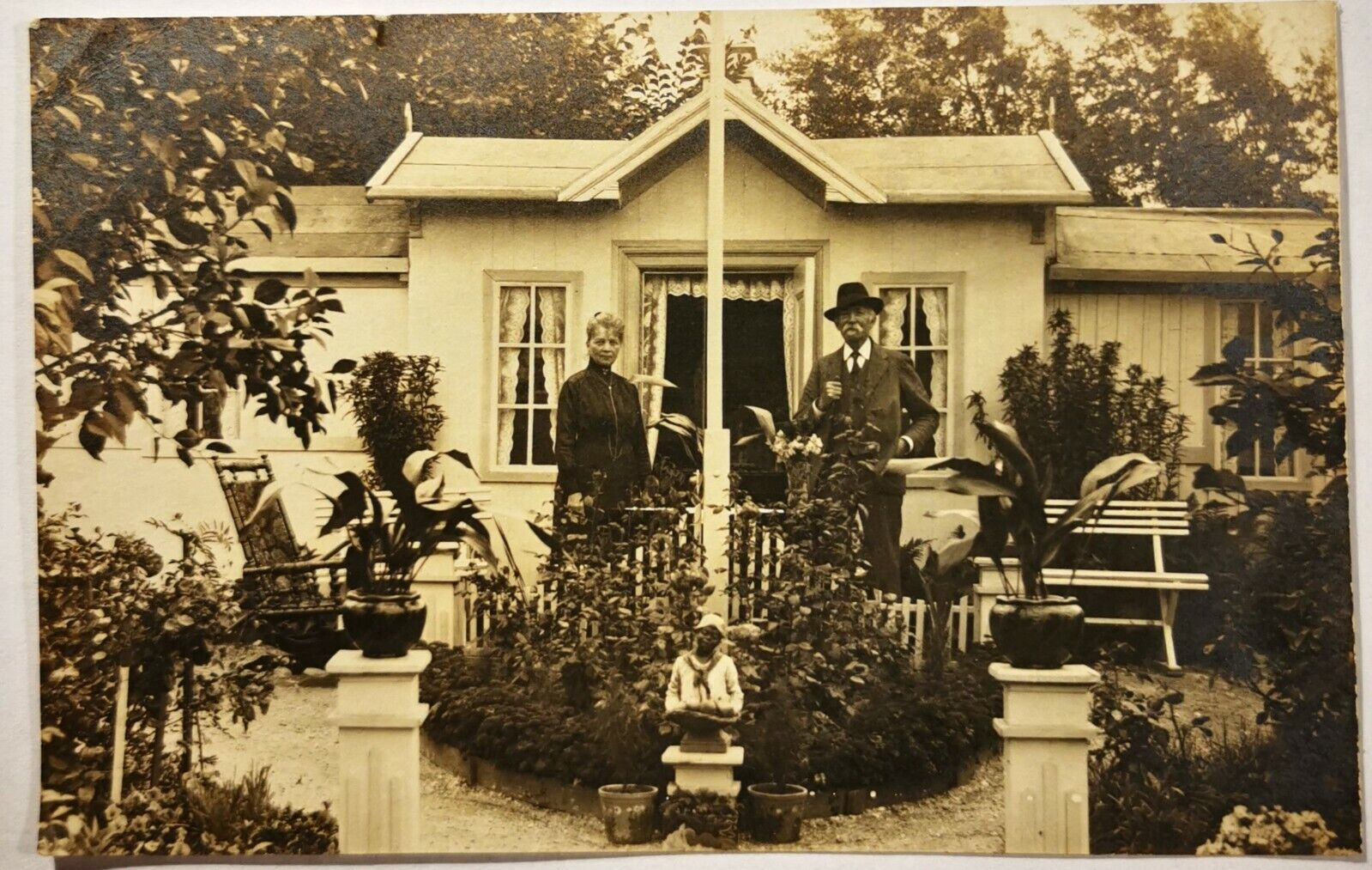 Photo postcard: Couple in front of their ornate allotment garden house  pok1242