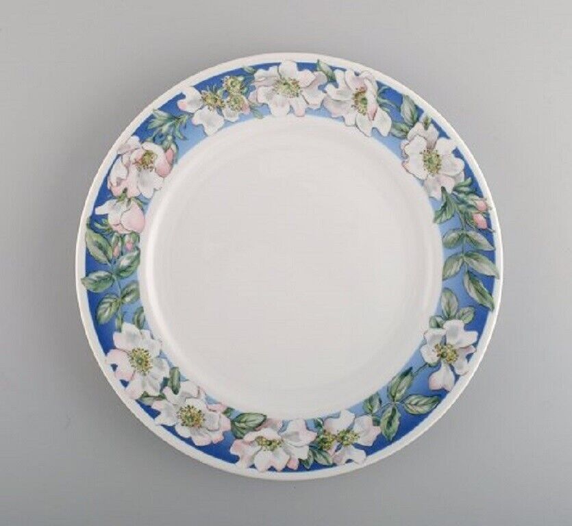 Four Royal Copenhagen White Rose dinner plates with blue border white flowers