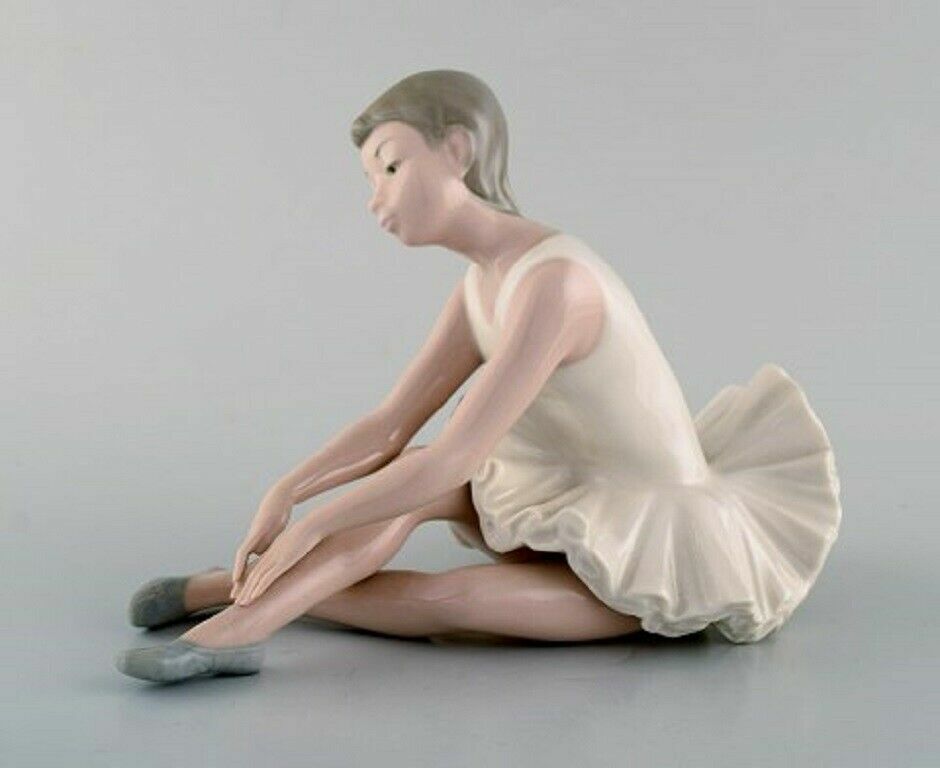 Lladro Nao and Rex Spain Four porcelain figurines of young girls 1970/80's