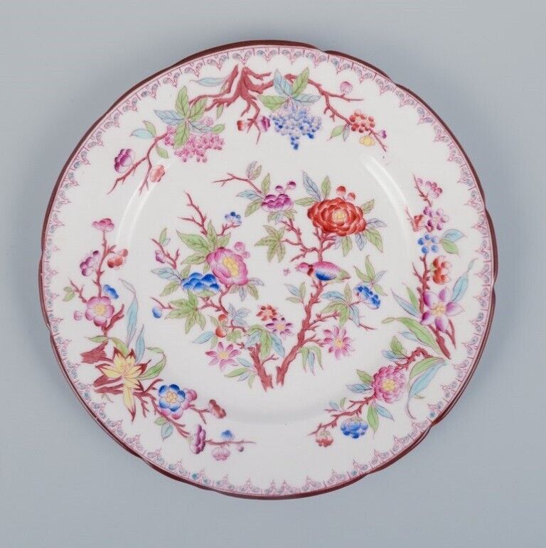 Sarreguemines France a set of six porcelain plates with floral motifs