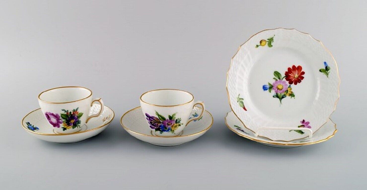 Two Royal Copenhagen Saxon Flower coffee cups with saucers and two plates