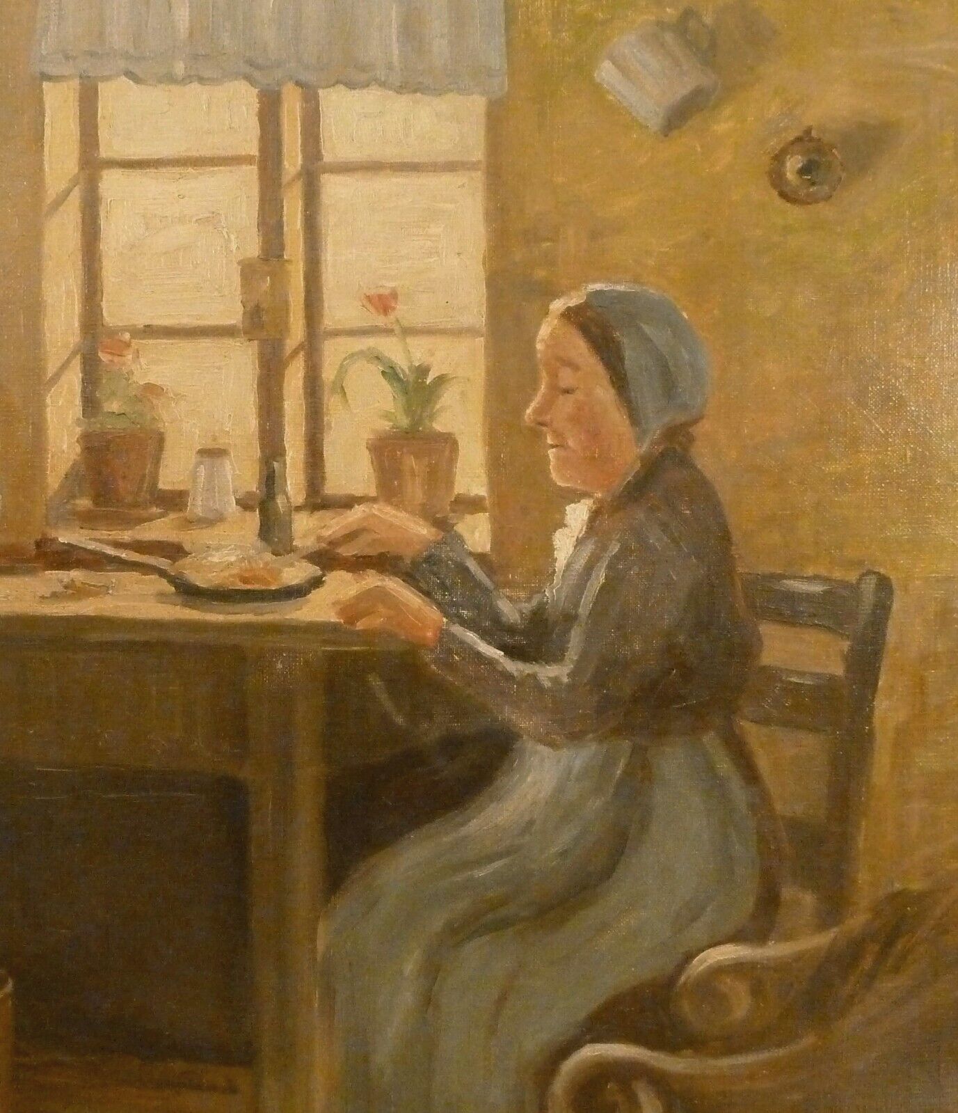 J DUVAL! INTERIOR WITH OLDER WOMAN PREPARING DINNER