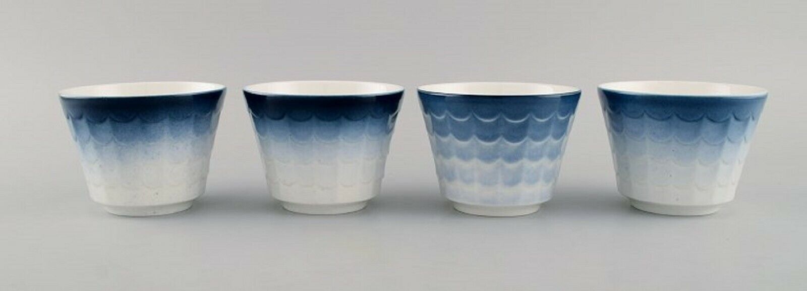 Wilhelm Kåge for Gustavsberg Four flower pot covers in porcelain