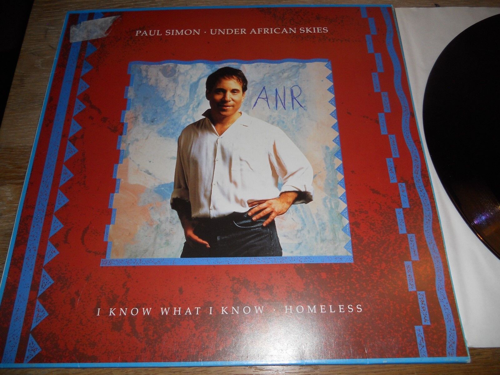 PAUL SIMON "UNDER AFRICAN SKIES / I KNOW WHAT I KNOW / HOMELESS"12" VINYL SINGLE