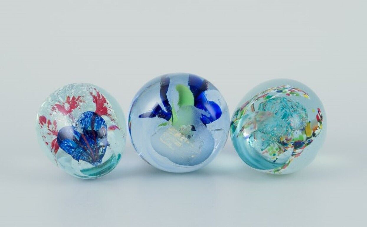 Scandinavian glass artist Set of three paperweights in art glass Flower motifs