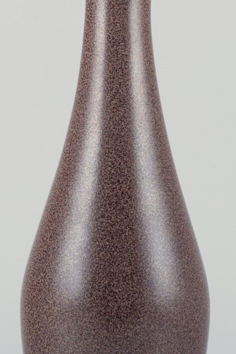 European studio ceramicist ceramic vase with speckled glaze in brown tones