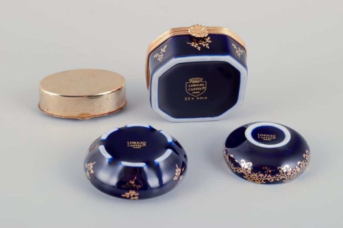 Limoges France Four lidded porcelain boxes two with brass mounts