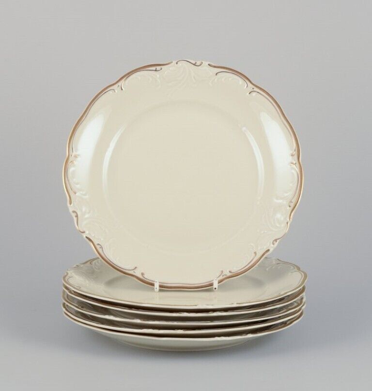 KPM Poland A set of six porcelain lunch plates Cream-colored with gold rim