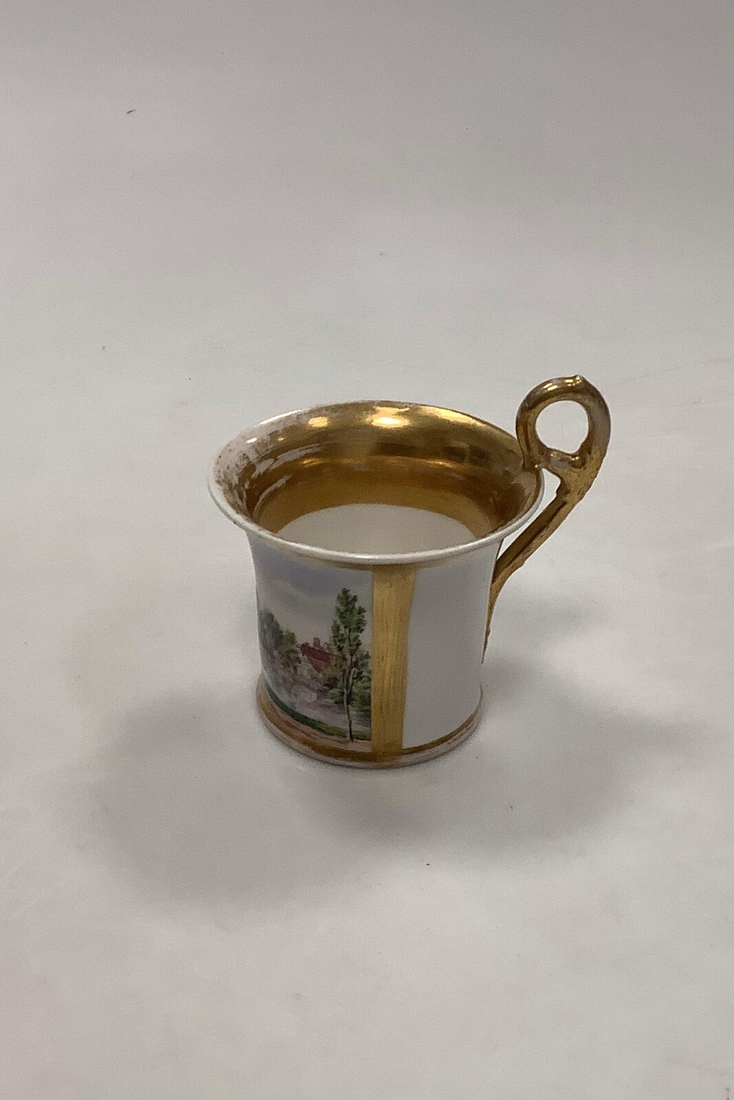 Antique Royal Copenhagen Cup with motif of house and lake