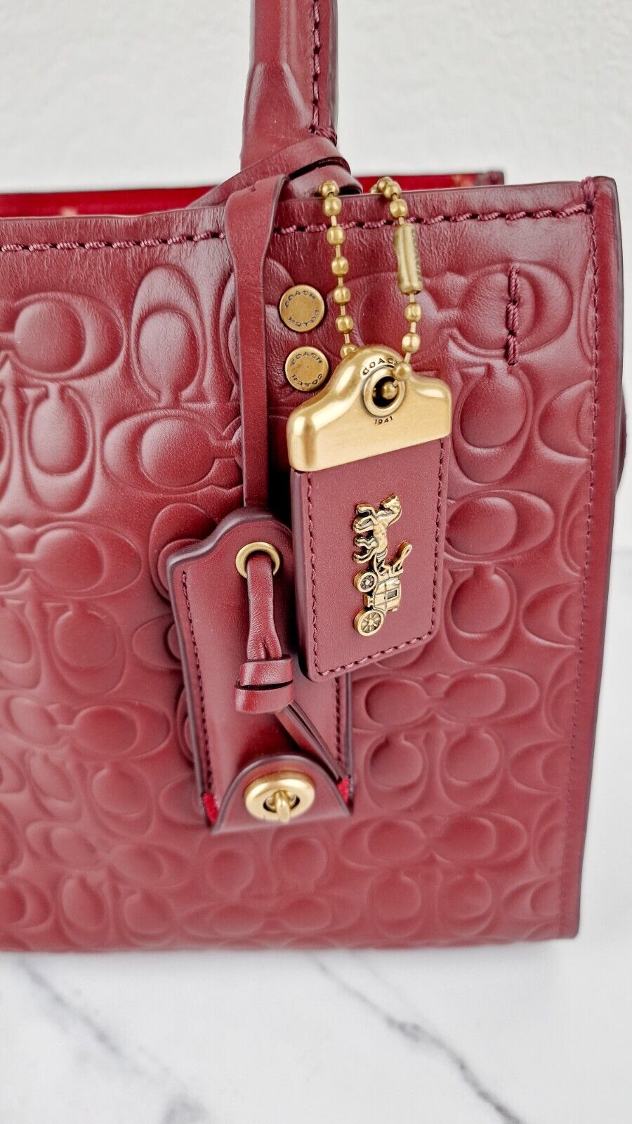 Coach Rogue 25 in Burgundy Signature Embossed Leather Floral Bow Lining 26839