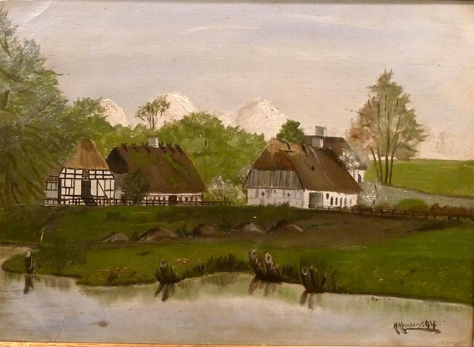 H. HANSEN! VILLAGE SCENERY WITH OLD HOUSES AT THE POND