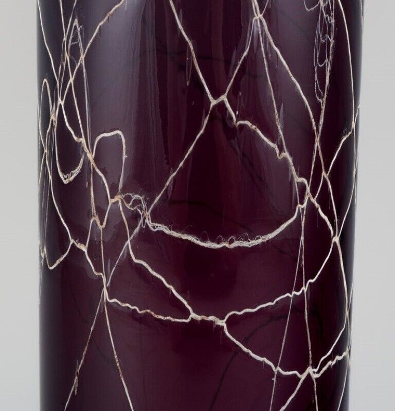 Purple hand-blown art glass vase decorated with silvery threads