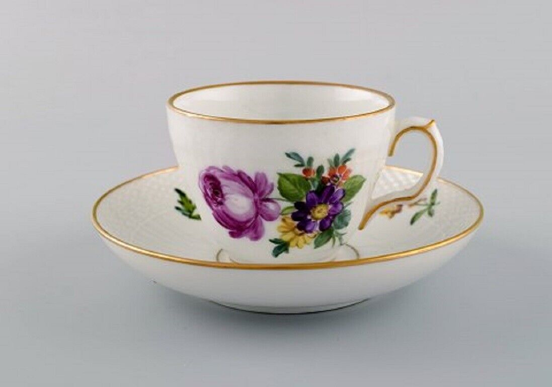 Two Royal Copenhagen Saxon Flower coffee cups with saucers and two plates