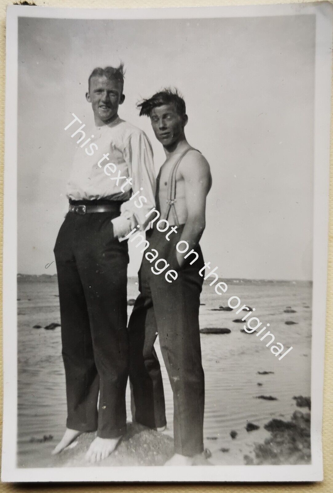 Old photo: Two handsome young men standing close together on a rock  Fo3027