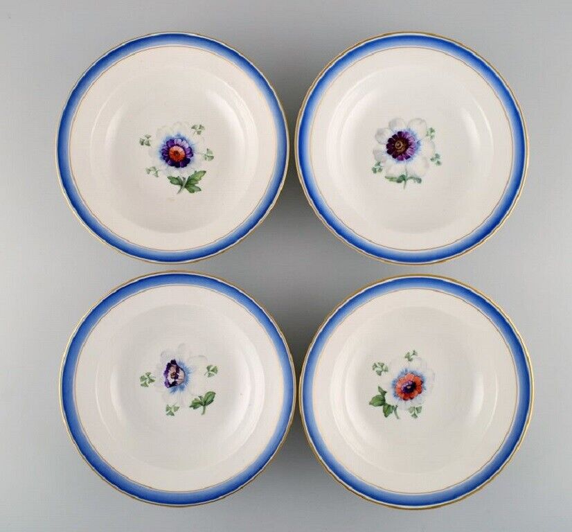 Four antique Royal Copenhagen deep plates in hand-painted porcelain