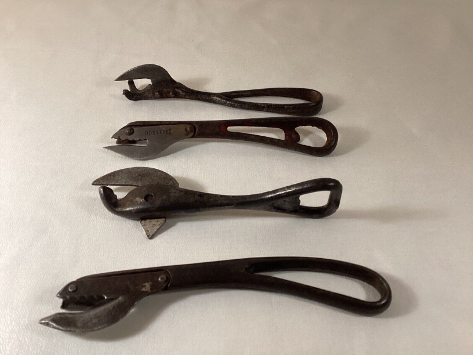 Lot of 4 antique metal can openers