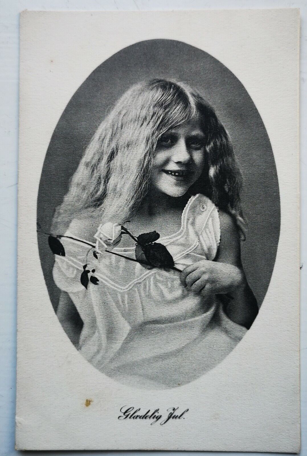 Old postcard: Young girl with long blonde hair and rose in the hand  pok1484