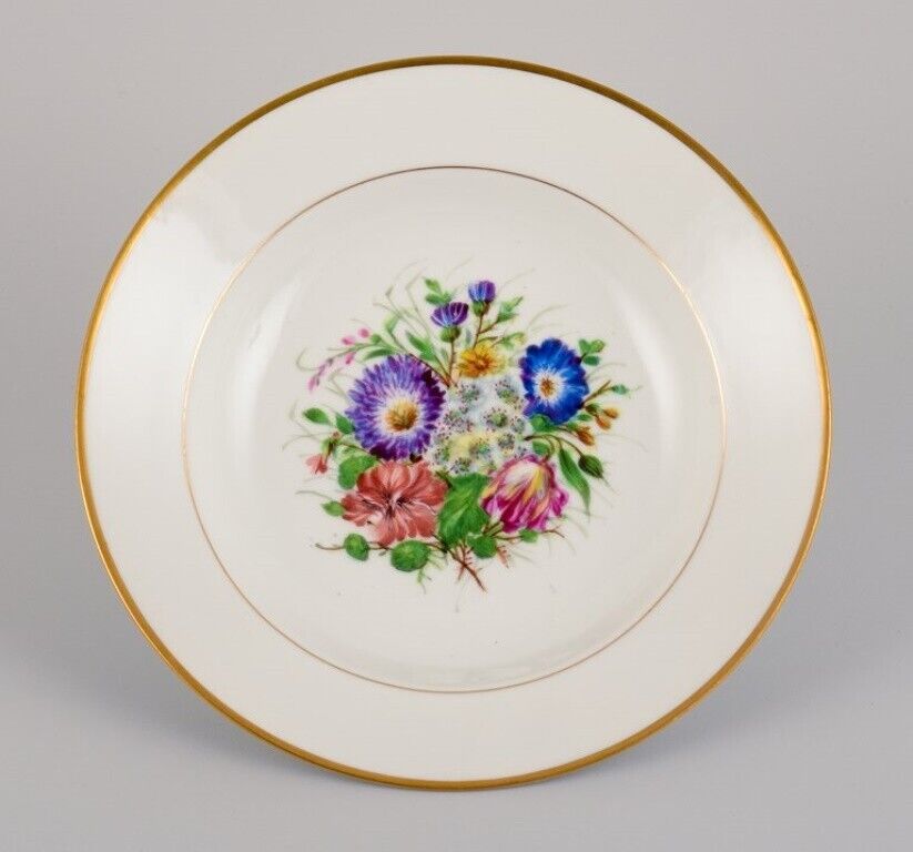 Bing  Grøndahl eight deep plates in porcelain with flowers and gold decoration