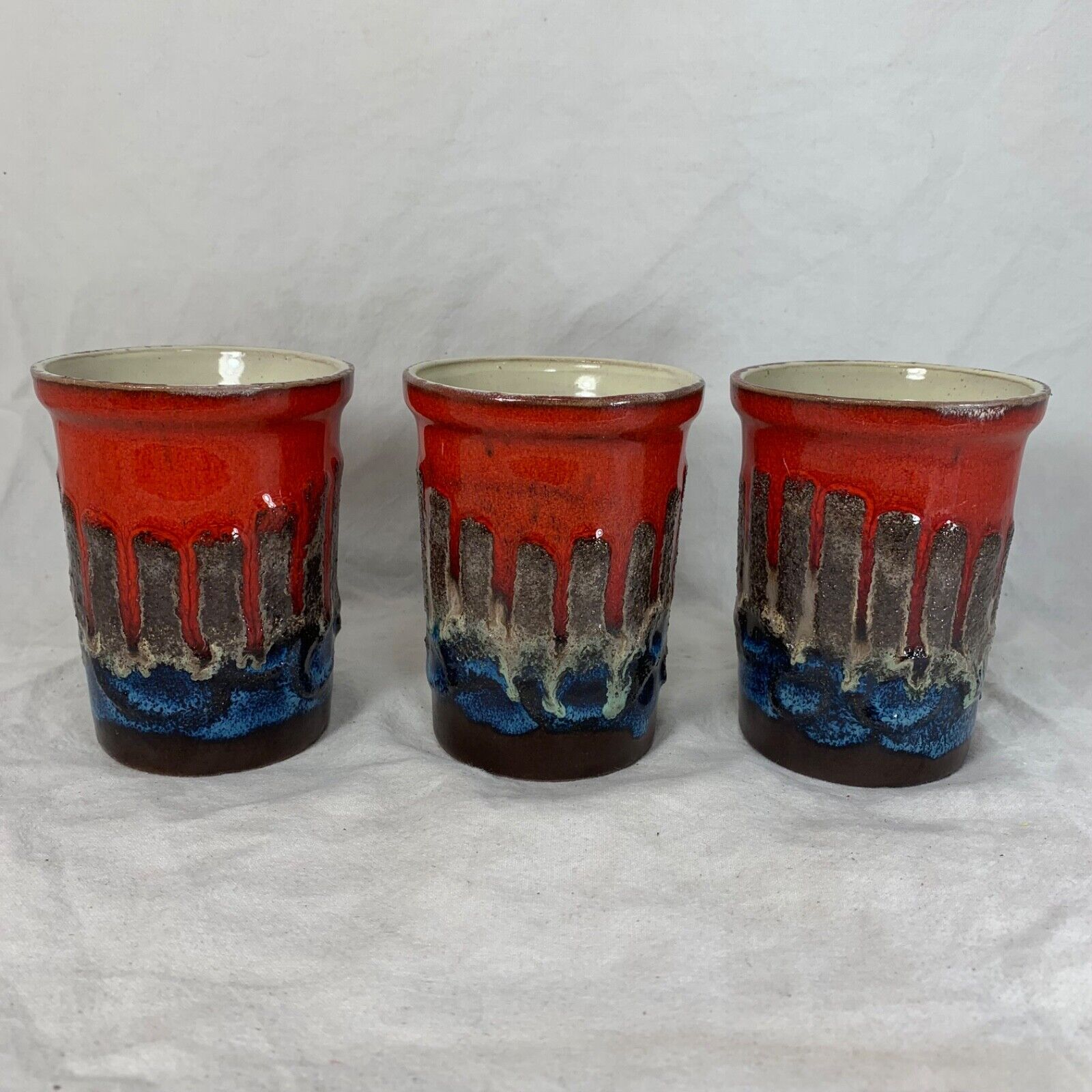 Vintage Strehla fat lava ceramic pitcher and cups red blue Germany