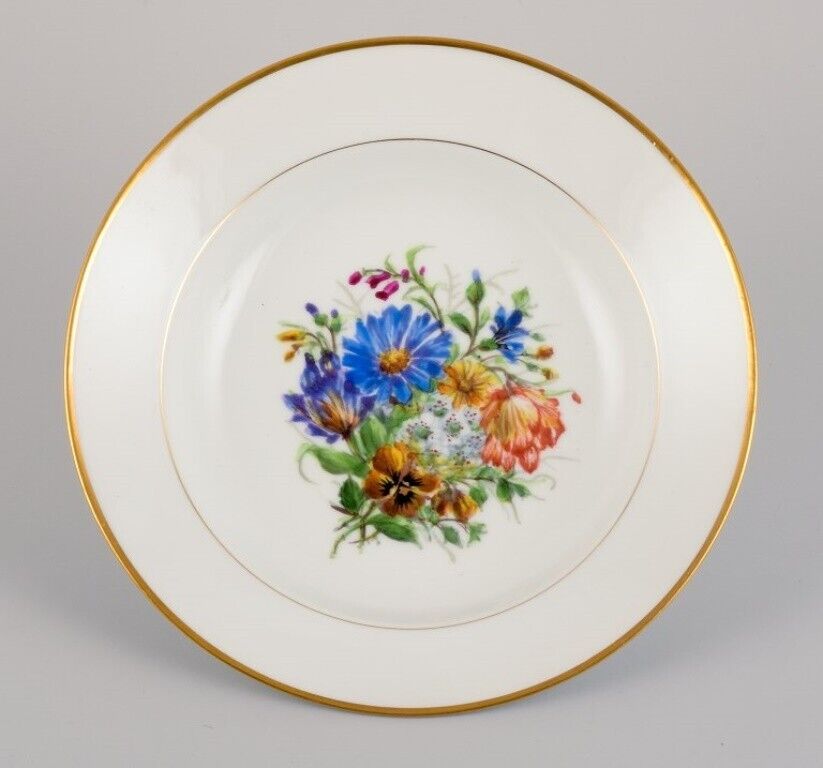 Bing  Grøndahl eight deep plates in porcelain with flowers and gold decoration