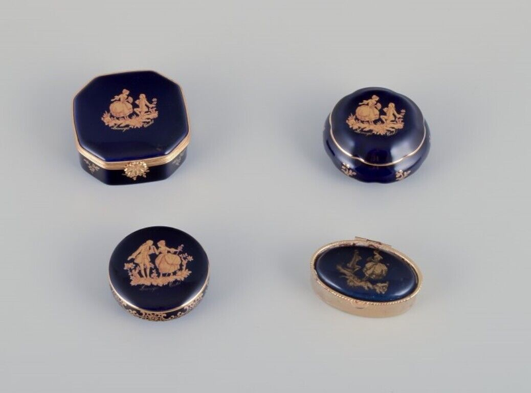 Limoges France Four lidded porcelain boxes two with brass mounts