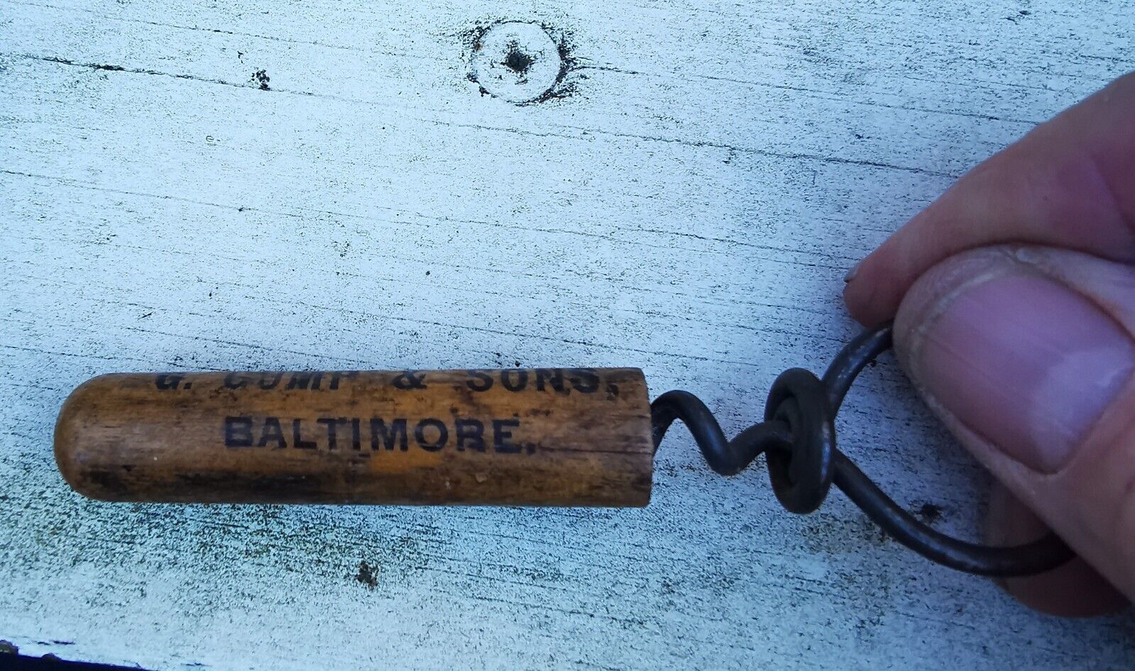 G Gump  Son Whiskey Baltimore metal corkscrew with wooden cap c 1910