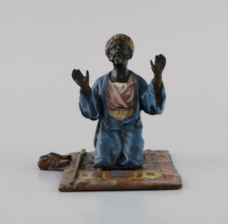 Antique cold-painted Vienna bronze shaped as praying man on a prayer mat