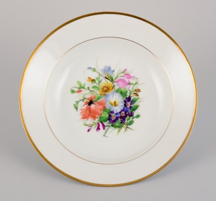 Bing  Grøndahl eight deep plates in porcelain with flowers and gold decoration