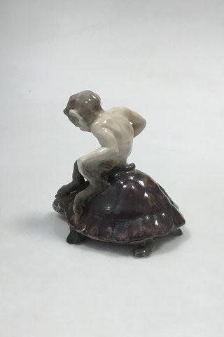 Royal Copenhagen Figurine of faun sitting on a turtle No 1880