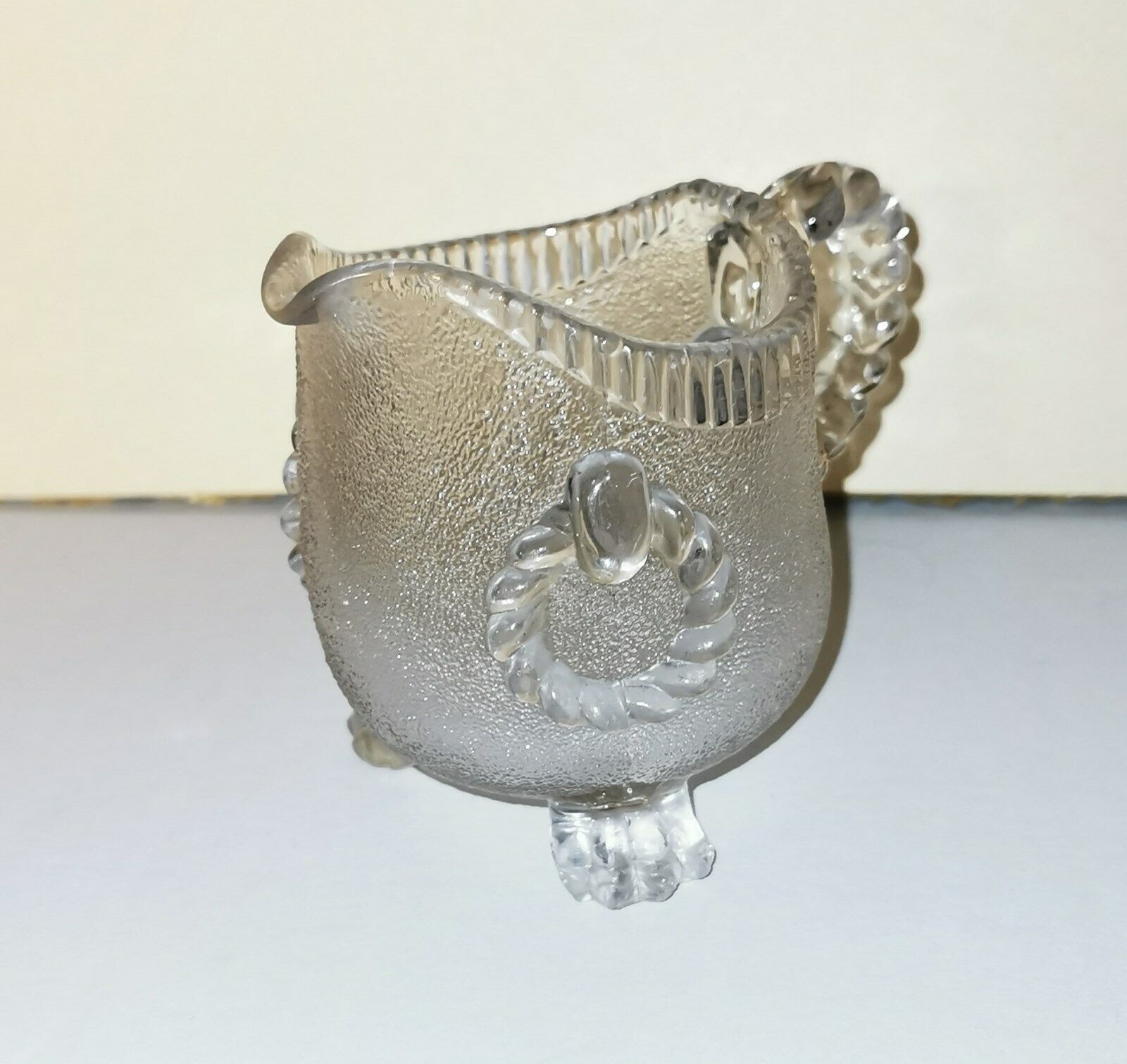 Charming antique pressed glass creamer pitcher on three feet from U K c 1900