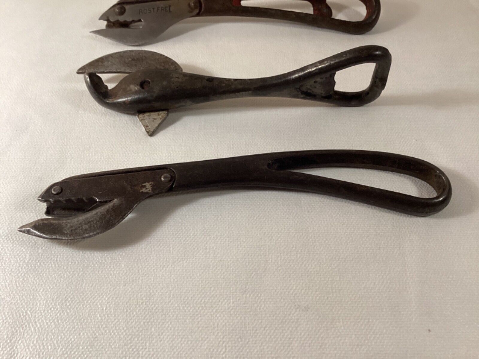 Lot of 4 antique metal can openers