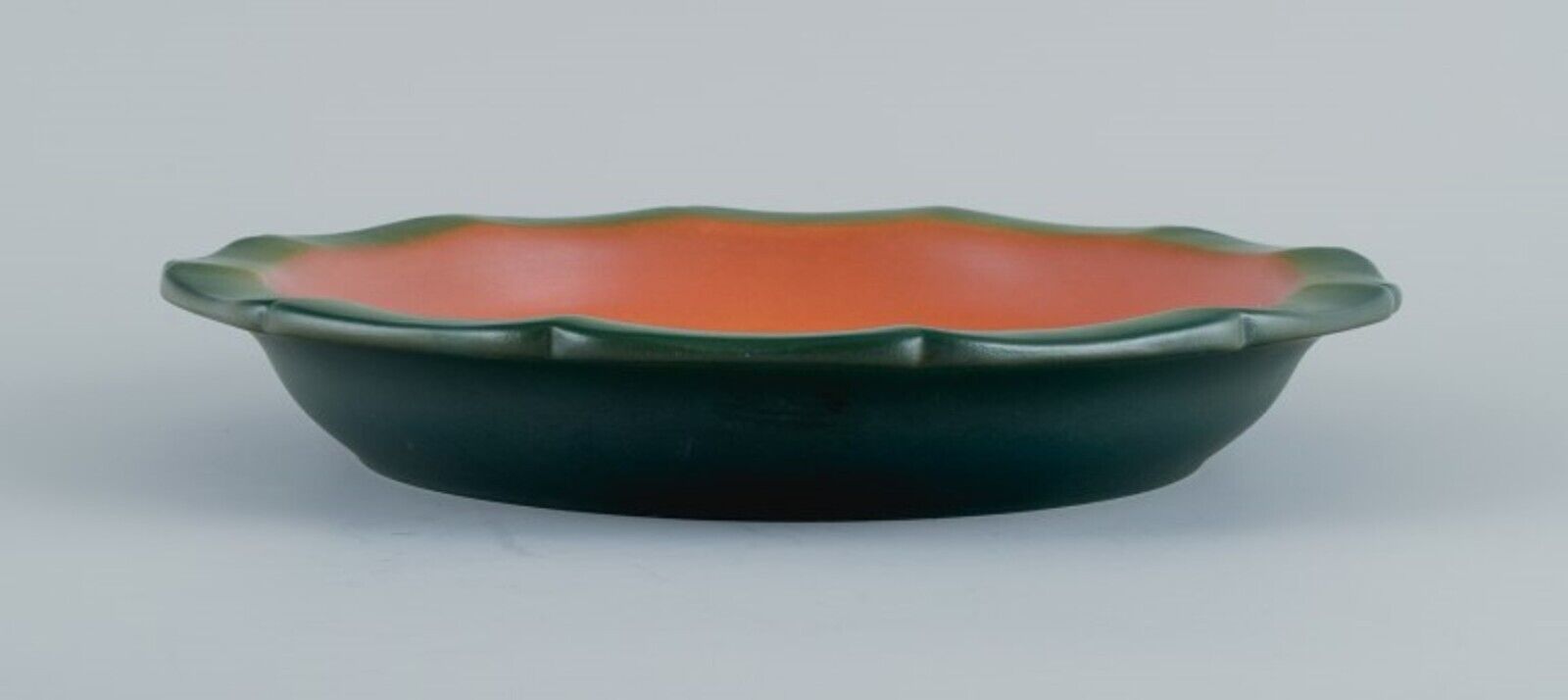 Ipsens Denmark dish with fish with glaze in orange-green shades