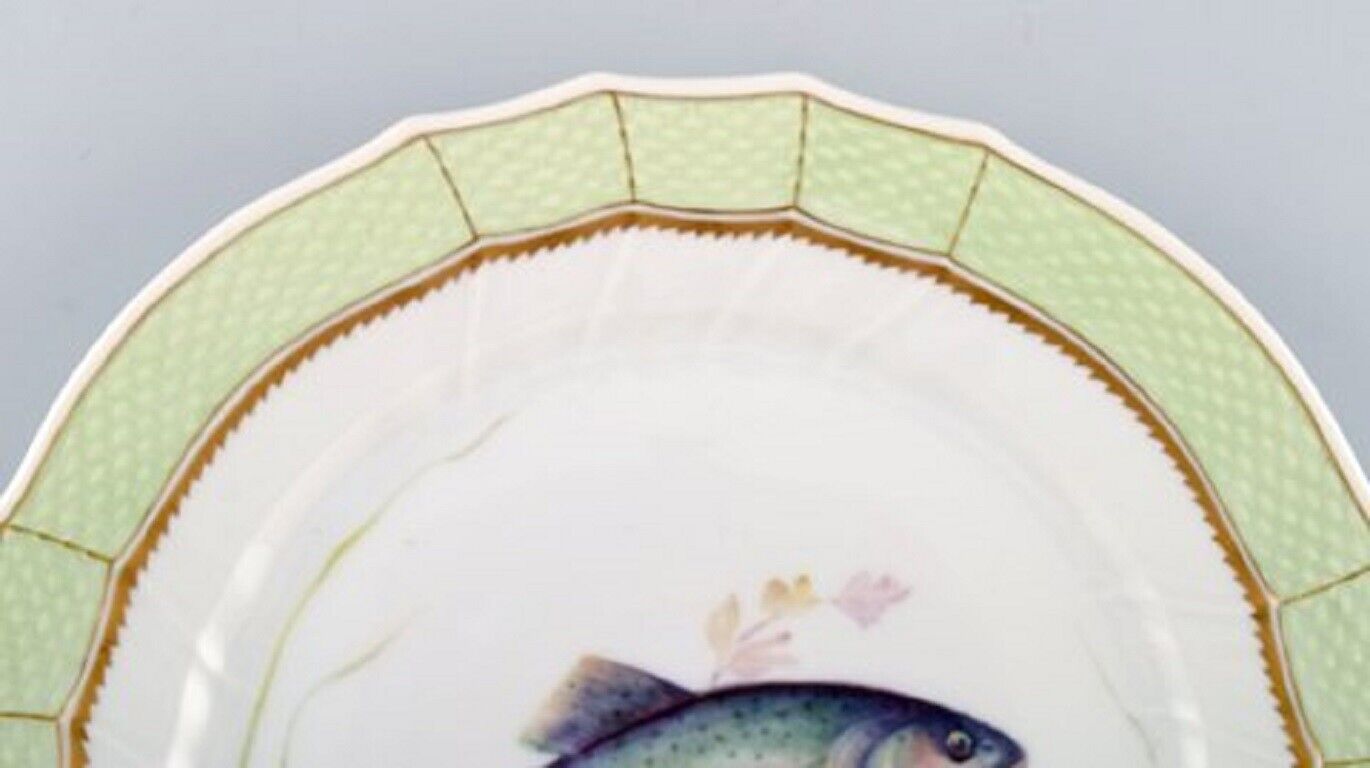 Royal Copenhagen fish plate with green edge gold decoration and fish motif