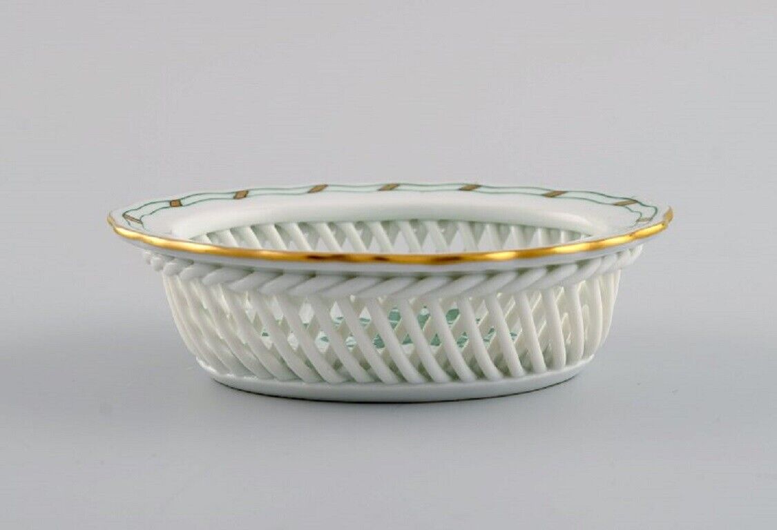 Two Herend bowls in openwork porcelain with hand-painted flowers