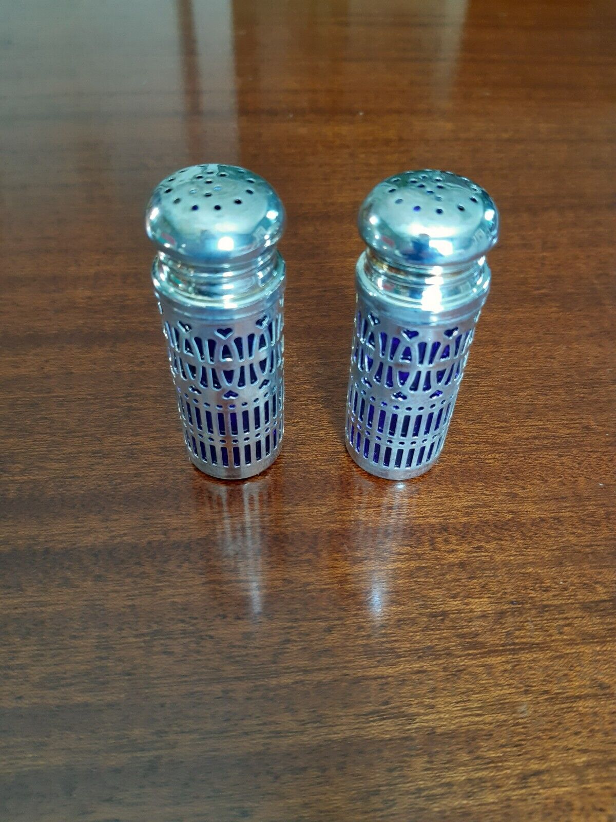 Salt and pepper metal and cobalt blue glass shaker