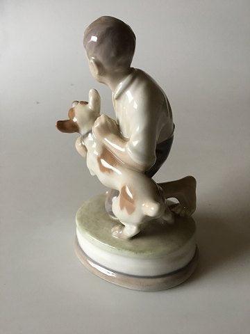 Royal Copenhagen Figurine of Boy with dog No 2140