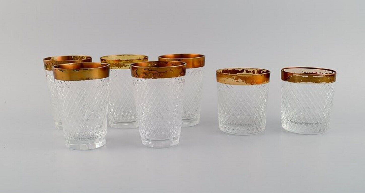 Seven drinking glasses in mouth-blown crystal glass with gold edge France 1930s