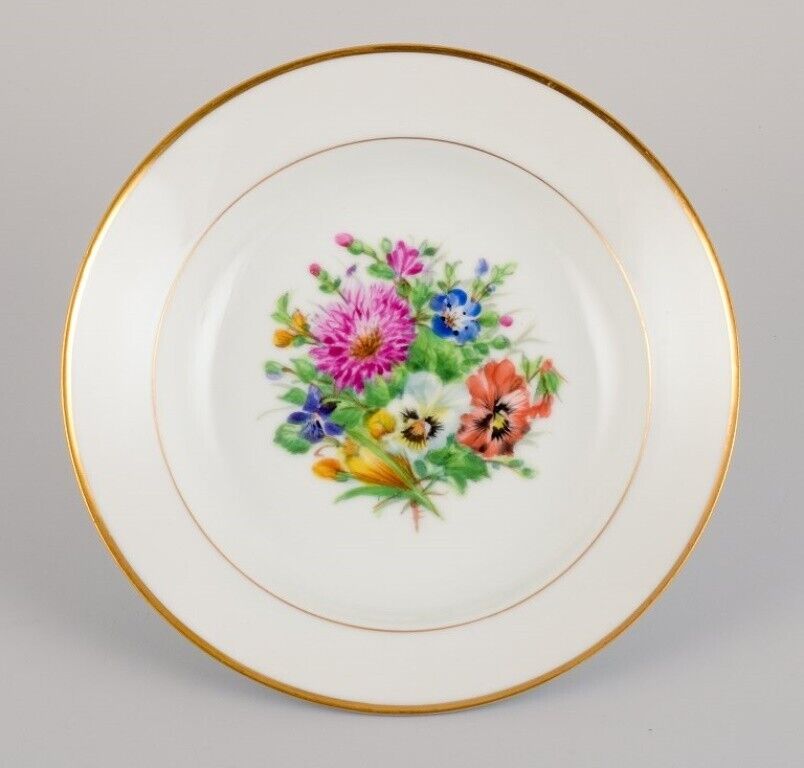 Bing  Grøndahl four deep plates in porcelain with flowers and gold decoration