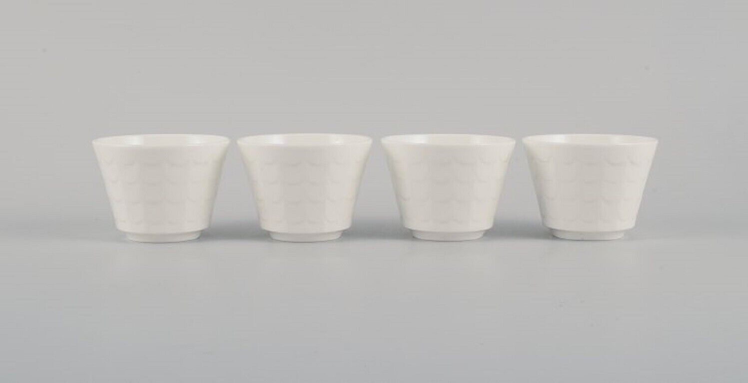 Wilhelm Kåge for Gustavsberg Four flower pot covers in porcelain