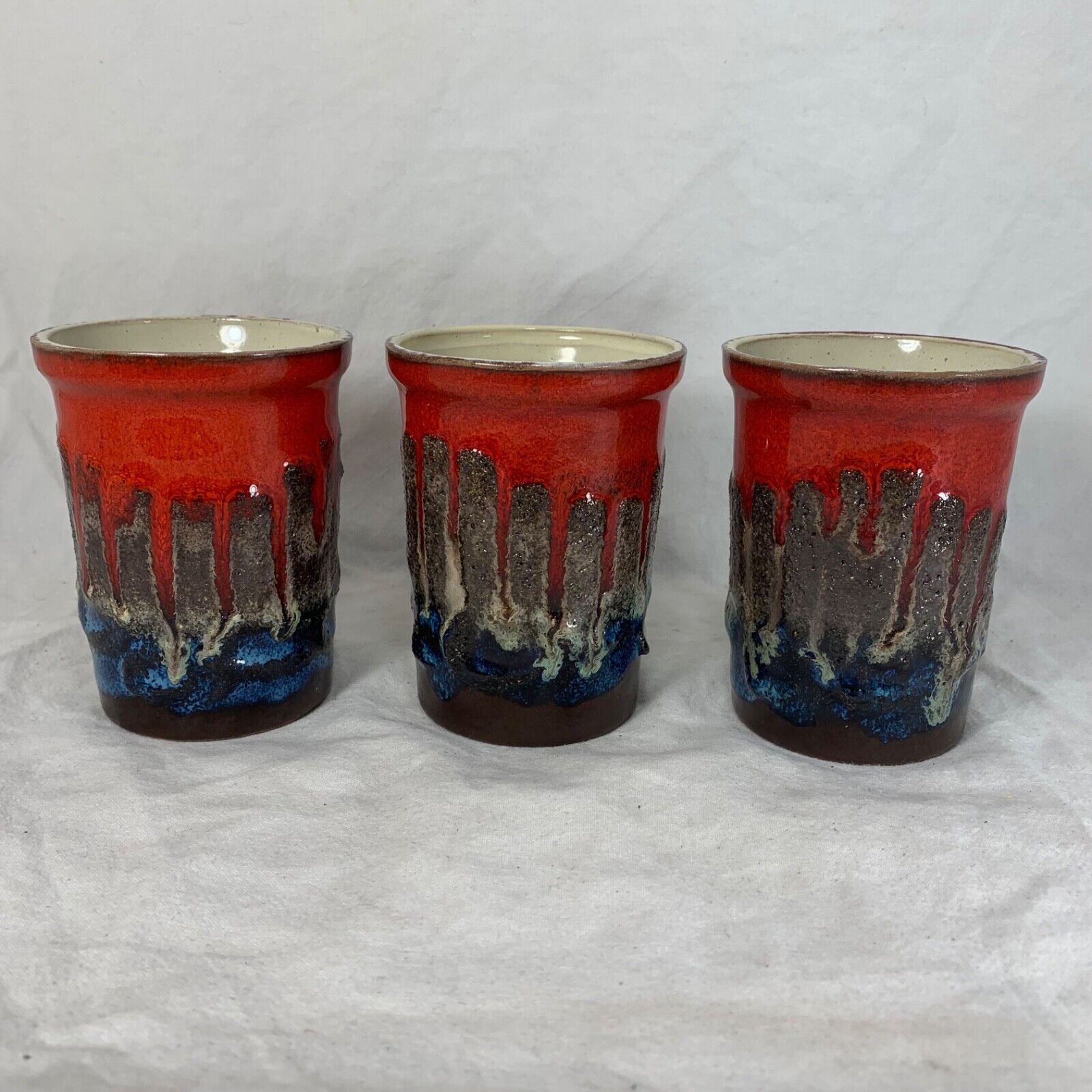 Vintage Strehla fat lava ceramic pitcher and cups red blue Germany