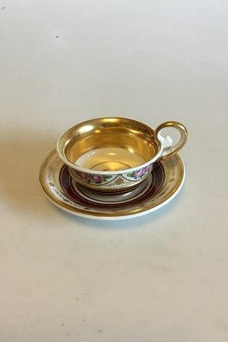 Empire style cup decorated with roses and gold Presumably Russian From