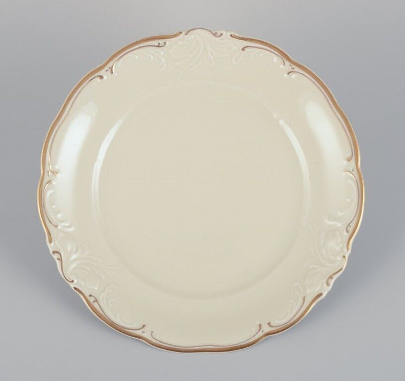 KPM Poland A set of six porcelain lunch plates Cream-colored with gold rim