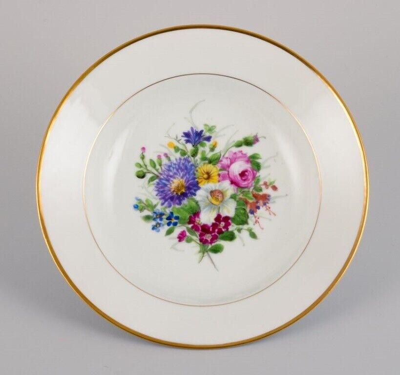 Bing  Grøndahl eight deep plates in porcelain with flowers and gold decoration