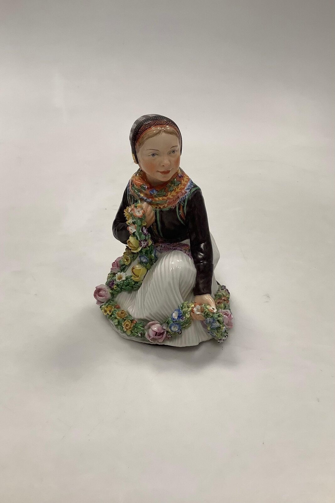 Royal Copenhagen Overglaze figurine of Amager Flower Girl No 12412