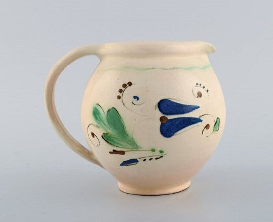 Kähler HAK Jug in glazed stoneware Flowers on a cream colored background