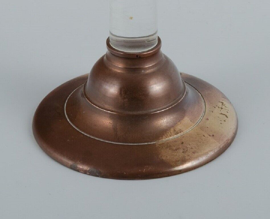 French candle holder in brass and clear glass in a modernist design