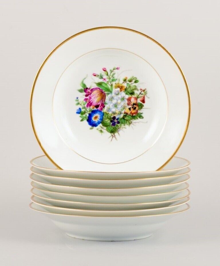 Bing  Grøndahl eight deep plates in porcelain with flowers and gold decoration