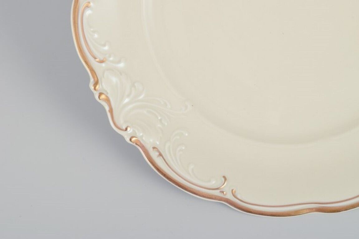 KPM Poland A set of five dinner plates in cream-colored porcelain