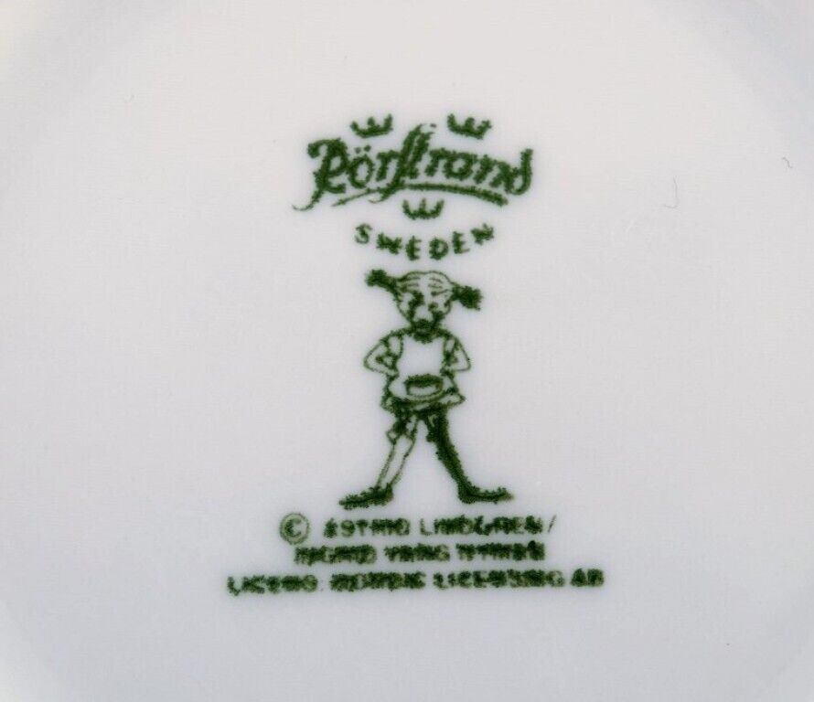 Rörstrand Four cups and a plate in porcelain with Pippi Longstocking motifs